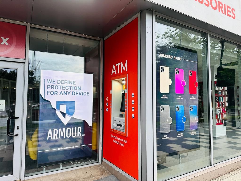 iFix side display with the "We define protection for any device" panel and Armour® Skins display — Timișoara